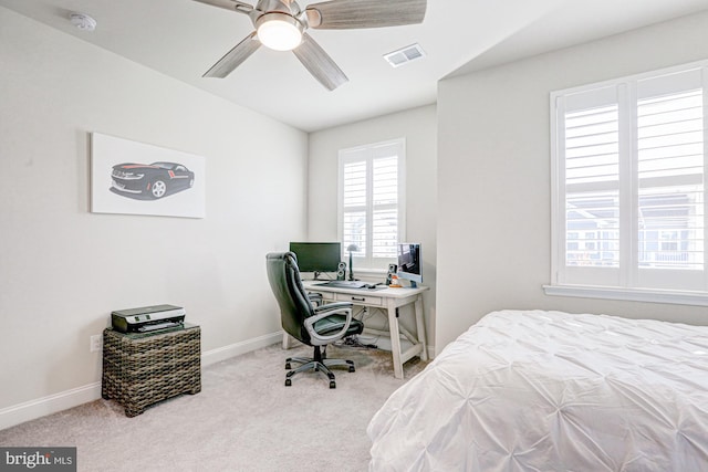 carpeted bedroom with ceiling fan