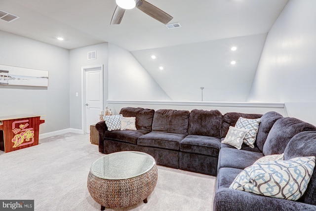 living room featuring ceiling fan, lofted ceiling, and light colored carpet