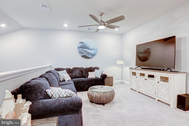 carpeted living room with lofted ceiling and ceiling fan