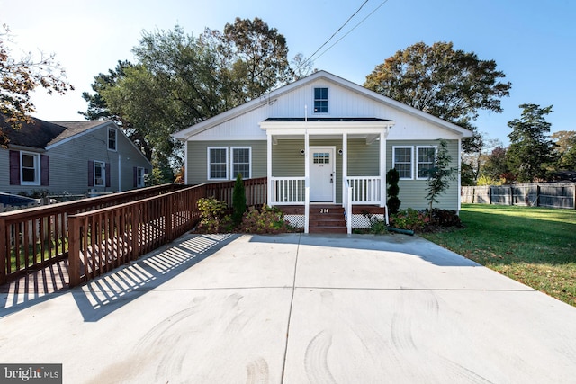 bungalow-style home with a front yard and a porch