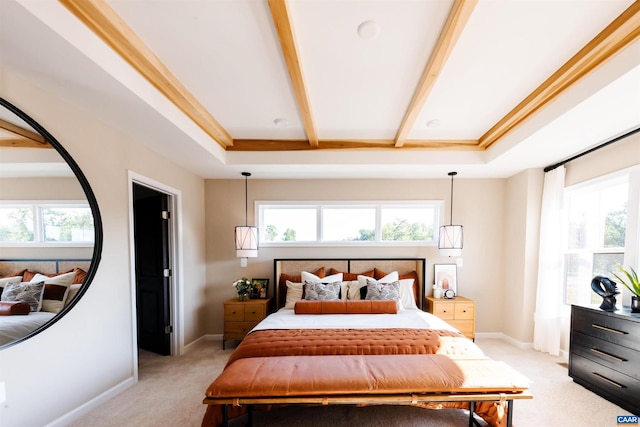 carpeted bedroom with beam ceiling