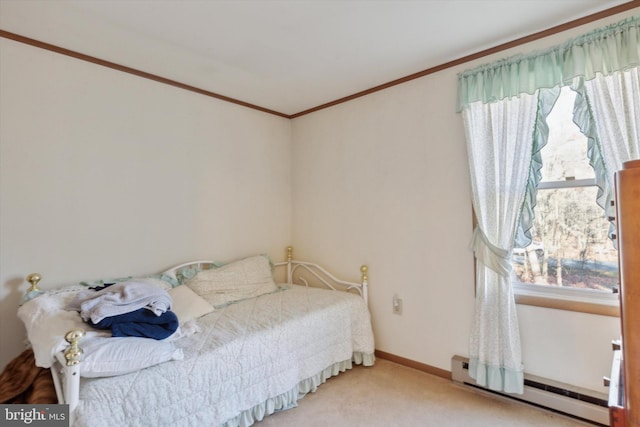 bedroom with ornamental molding, a baseboard heating unit, and carpet floors