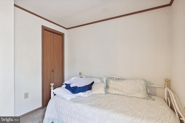 bedroom with crown molding and light colored carpet