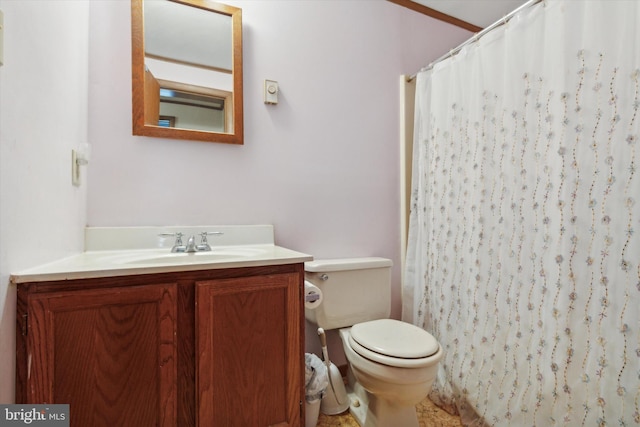 bathroom featuring vanity, crown molding, a shower with curtain, and toilet