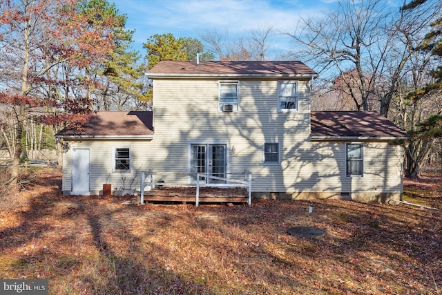 rear view of property featuring french doors and a deck