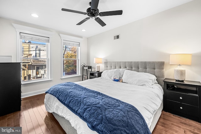 bedroom featuring ceiling fan and dark hardwood / wood-style flooring