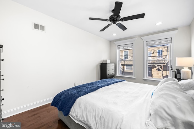 bedroom featuring dark wood-type flooring and ceiling fan