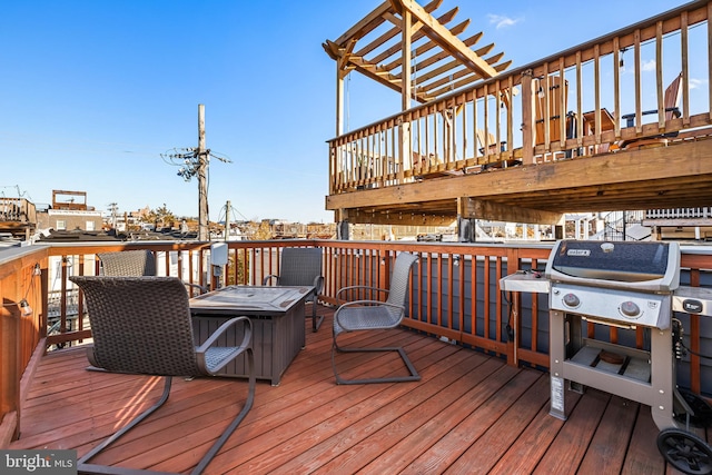 deck featuring a grill