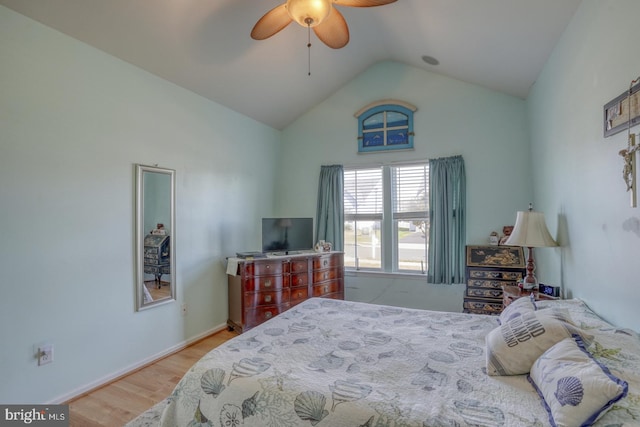 bedroom with lofted ceiling, ceiling fan, and light hardwood / wood-style flooring