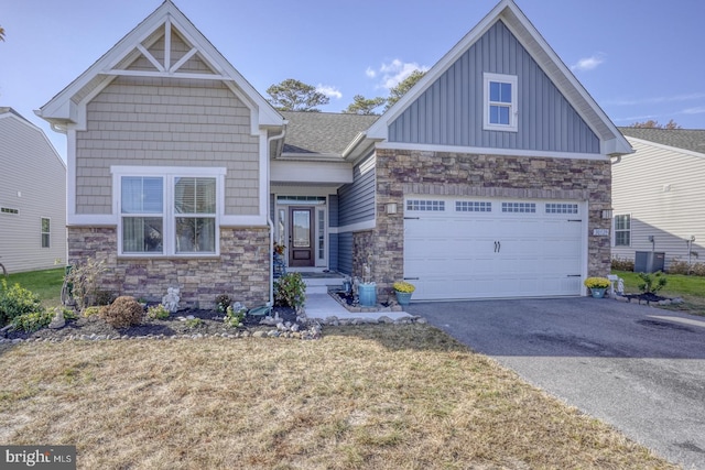 craftsman inspired home featuring a front lawn and a garage