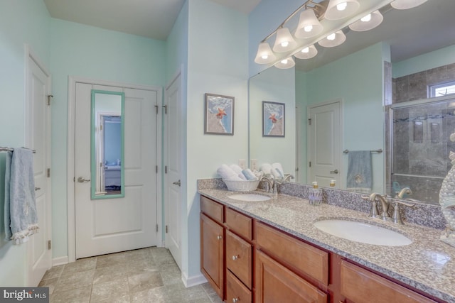 bathroom with walk in shower, tile patterned flooring, and vanity