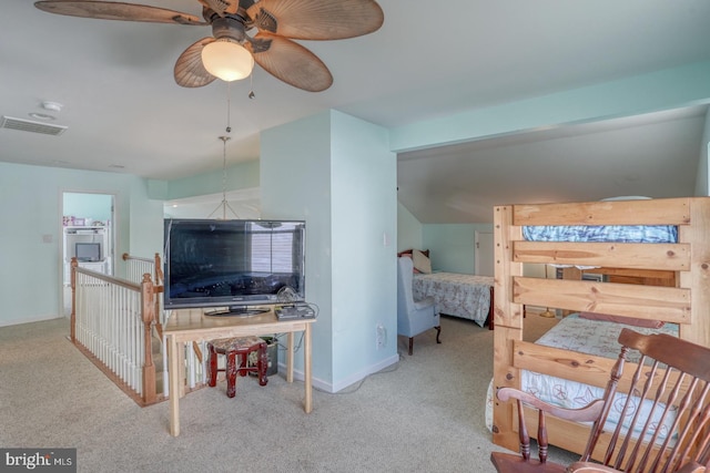 interior space featuring light carpet and ceiling fan