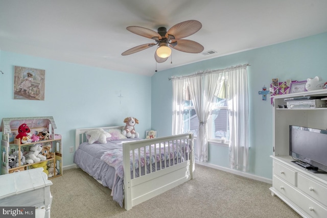 bedroom with light colored carpet and ceiling fan