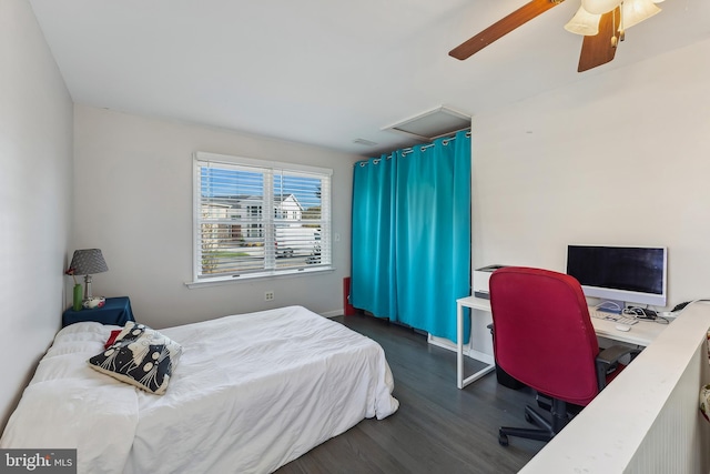 bedroom with ceiling fan and dark hardwood / wood-style floors