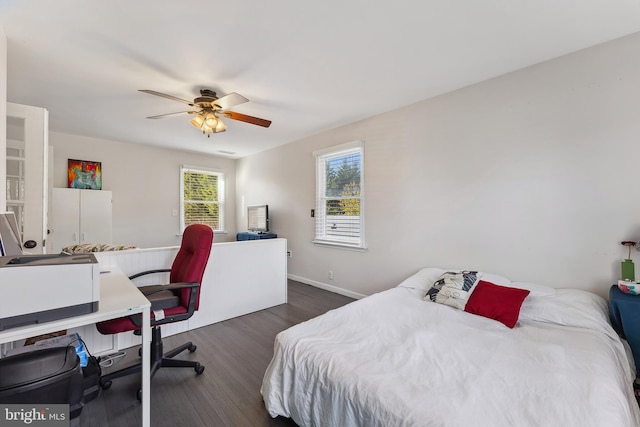 bedroom featuring dark wood-type flooring and ceiling fan