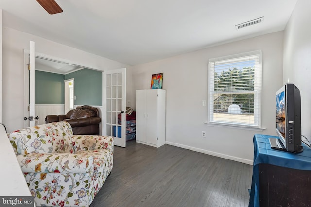 sitting room featuring french doors, ceiling fan, and dark hardwood / wood-style floors