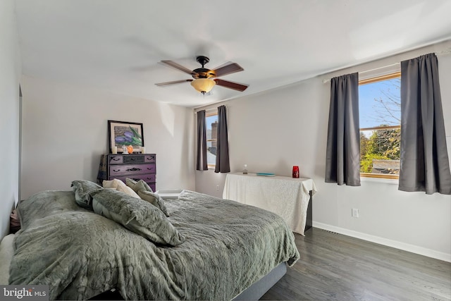 bedroom featuring dark hardwood / wood-style floors and ceiling fan