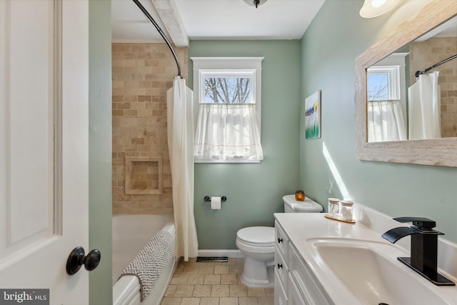 full bathroom featuring vanity, toilet, tile patterned floors, and shower / bathtub combination with curtain