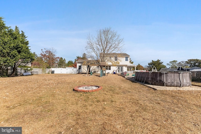 view of yard featuring an outdoor fire pit