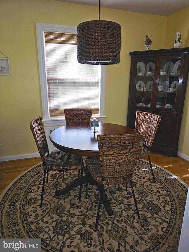 dining room with wood-type flooring