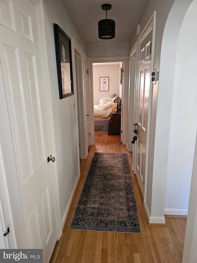 hallway with light wood-type flooring