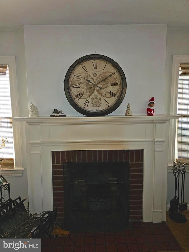 details featuring a brick fireplace