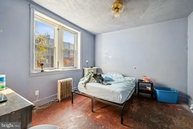 bedroom featuring a textured ceiling, dark wood-type flooring, radiator heating unit, and ceiling fan