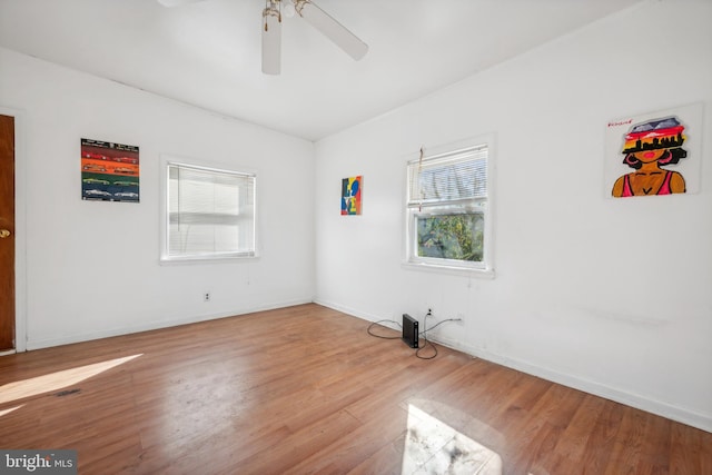 unfurnished room with light hardwood / wood-style floors and ceiling fan