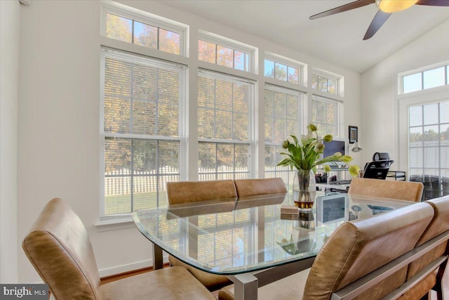 sunroom / solarium featuring ceiling fan and lofted ceiling