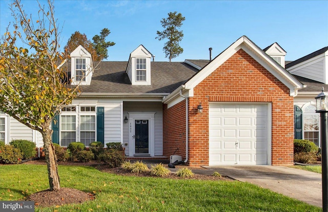 view of front of house featuring a front yard and a garage