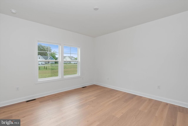 empty room with light wood-type flooring