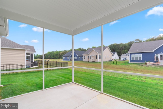 unfurnished sunroom with a wealth of natural light