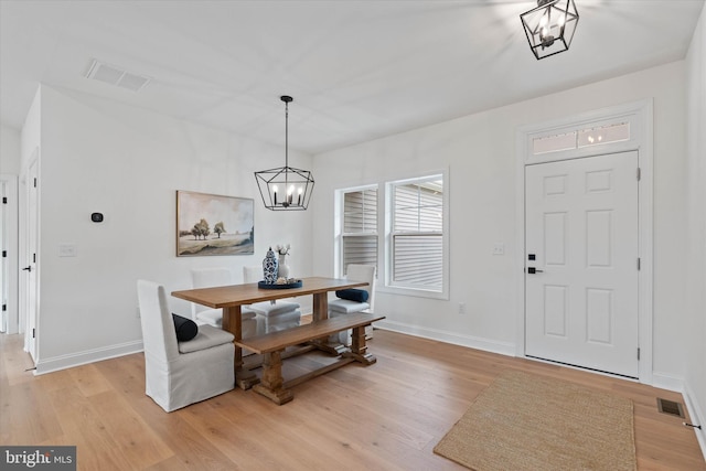 dining area featuring light wood-type flooring