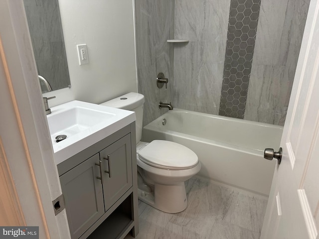 full bathroom with vanity, toilet, and tiled shower / bath