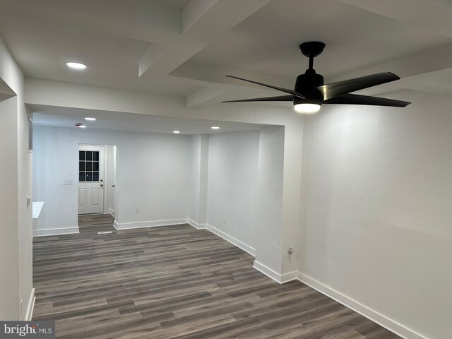 basement featuring dark hardwood / wood-style floors and ceiling fan