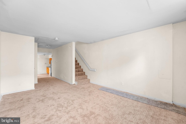 basement with light colored carpet