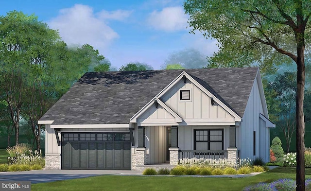 view of front of home featuring a front yard and a garage