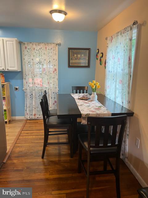 dining space featuring dark hardwood / wood-style flooring