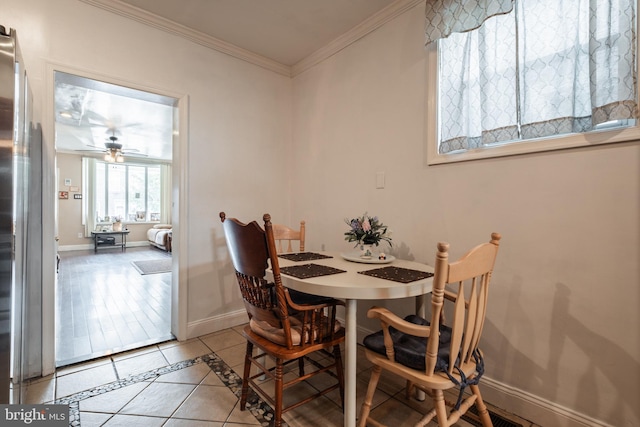 dining area with crown molding, hardwood / wood-style flooring, and ceiling fan