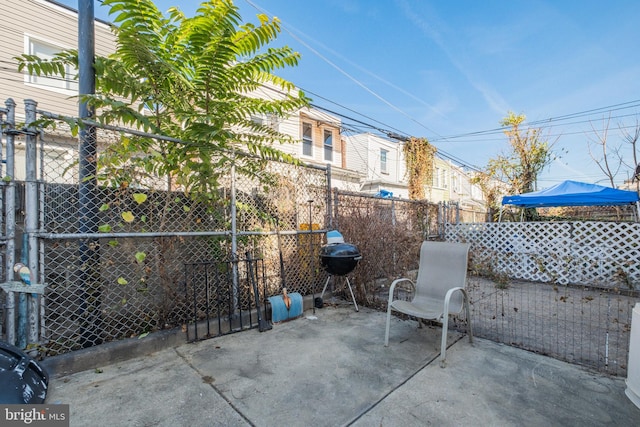 view of patio featuring a grill