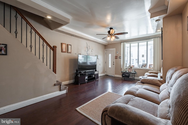 living room featuring crown molding, dark hardwood / wood-style floors, and ceiling fan