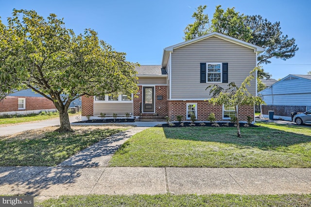 split level home with a front yard