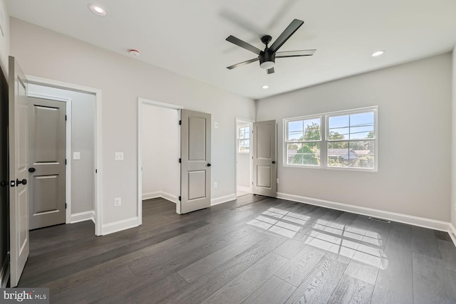 unfurnished bedroom with dark wood-type flooring and ceiling fan