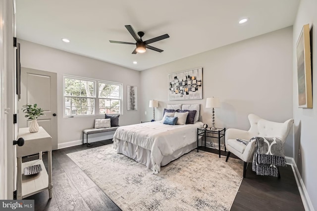 unfurnished bedroom with baseboards, a ceiling fan, a closet, and dark wood finished floors