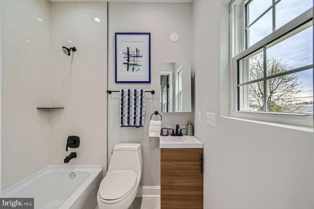 full bathroom with baseboards, vanity, toilet, and bathing tub / shower combination