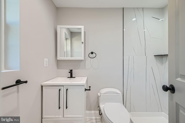 bathroom featuring vanity, a shower, and toilet