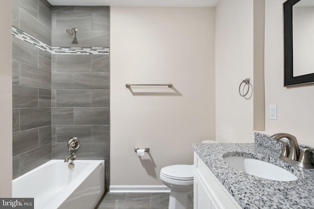 full bathroom featuring vanity, toilet, and tiled shower / bath