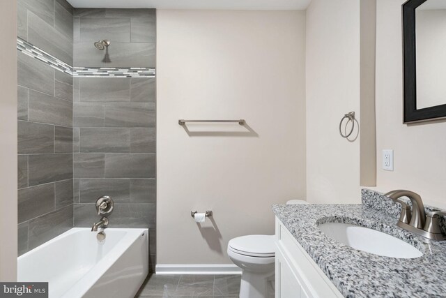 35 Grinnan Ln, Fredericksburg, VA 22406 - bathroom featuring baseboards, vanity, toilet, and washtub / shower combination