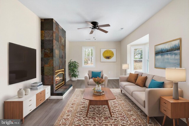 35 Grinnan Ln, Fredericksburg, VA 22406 - living area featuring dark wood-type flooring, ceiling fan, baseboards, and a tiled fireplace