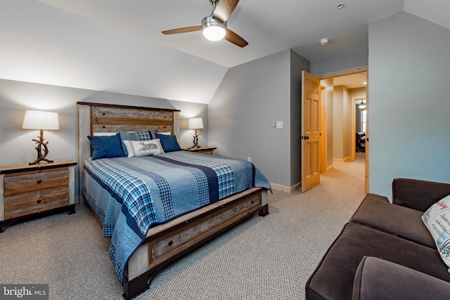 carpeted bedroom with lofted ceiling and ceiling fan